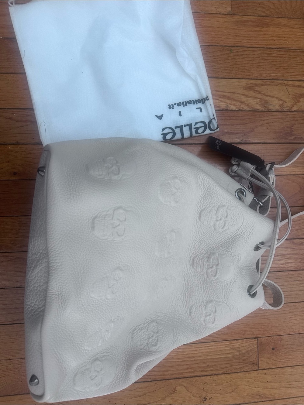 IO Pelle Skull Embossed Leather Drawstring Bag Bucket Latte